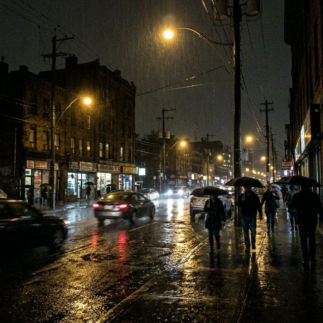 City street at night before editing — grainy and orange cast